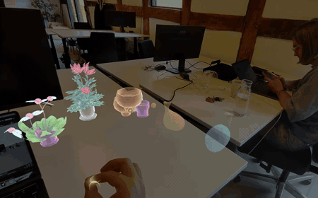 Spatial Desk augmented reality plants anchored on a desk in Spectacles